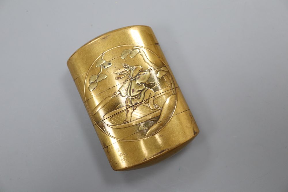 A 19th century Japanese gilt burnished lacquer Meiji period four case inro, with rabbit and bear central cartouches to both sides, sign